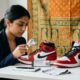 is kicks machine legit — sneaker authentication inspection table with verification tags for Indian sneaker buyers